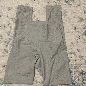 Barely worn light blue leggings with silver dots